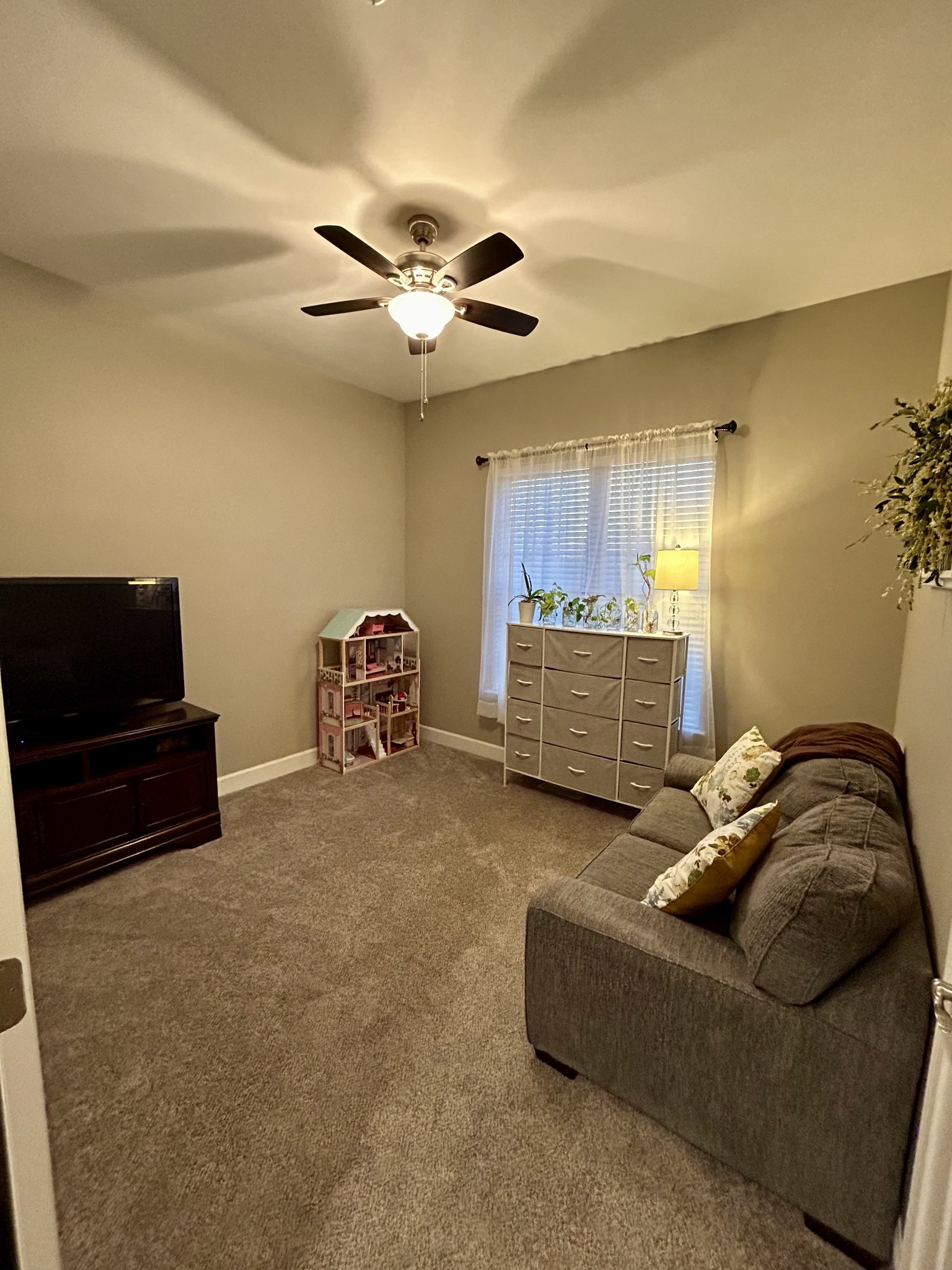 834 Blakemore Road Dickson, TN 37055 - Photo 22 of 26 a living room with furniture and a flat screen tv