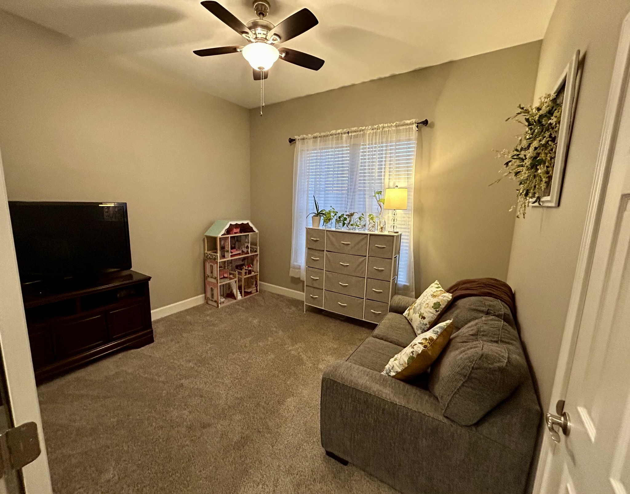 834 Blakemore Road Dickson, TN 37055 - Photo 24 of 26 a living room with furniture and a flat screen tv