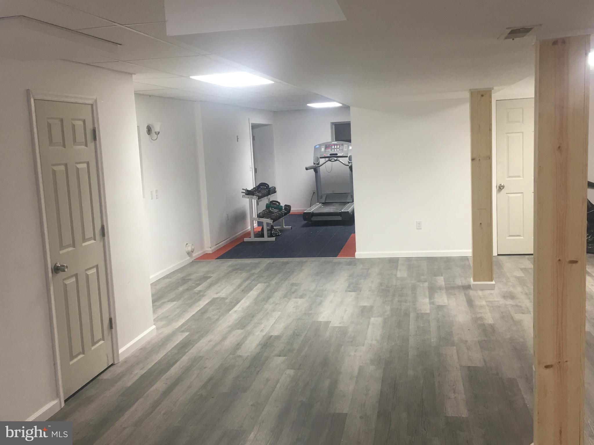 8385 Maryland Road Pasadena, MD 21122 - Photo 13 of 21 General gathering area in Basement