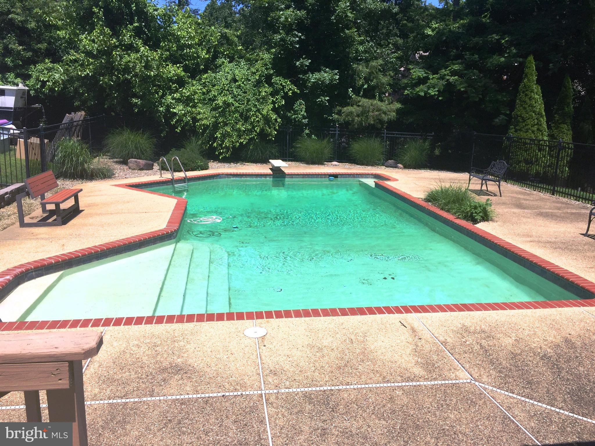 8385 Maryland Road Pasadena, MD 21122 - Photo 17 of 21 Last summer's view of pool area from the deck