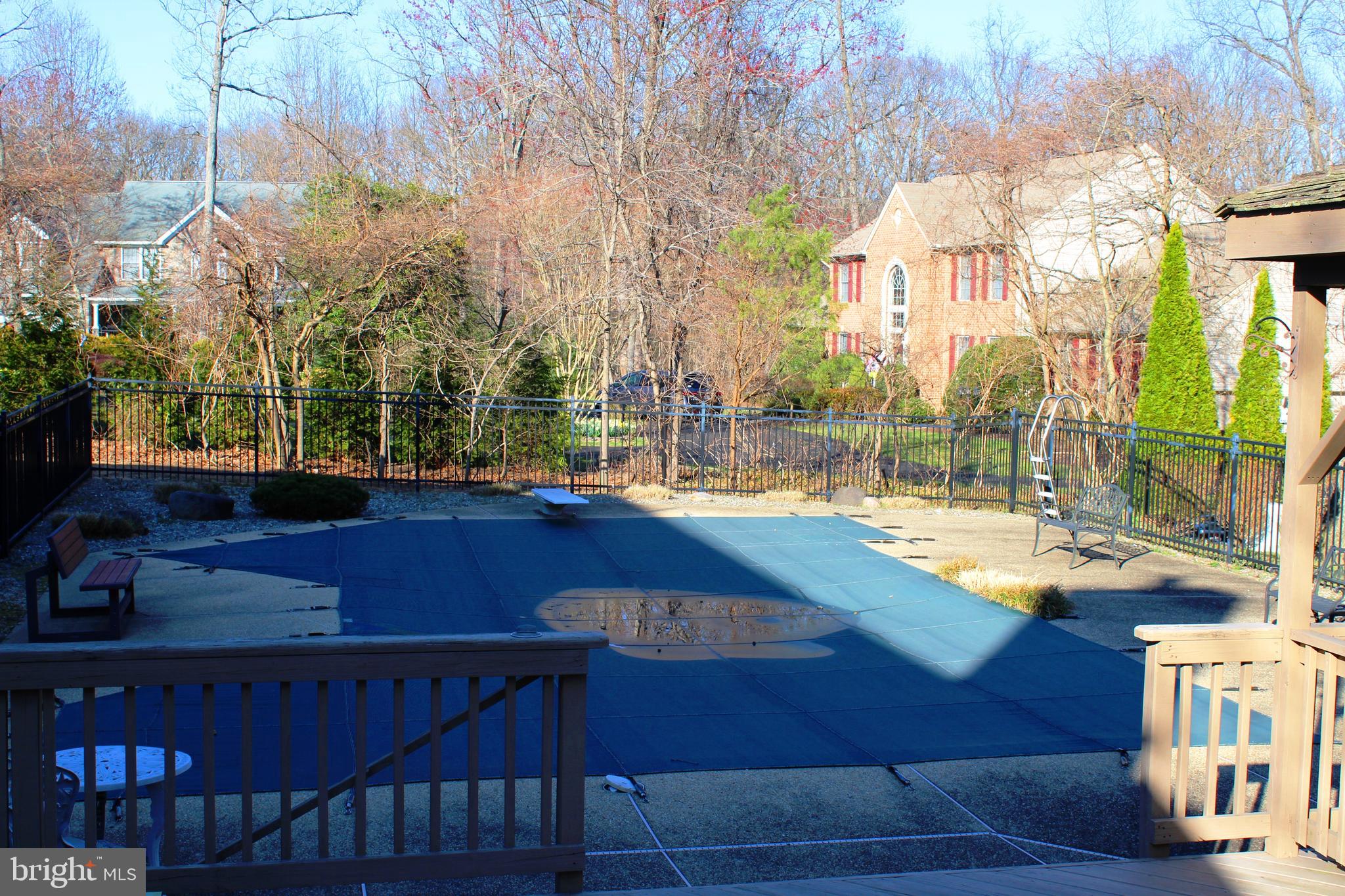 8385 Maryland Road Pasadena, MD 21122 - Photo 18 of 21 Pool viewed from the multi-level deck and crab bar