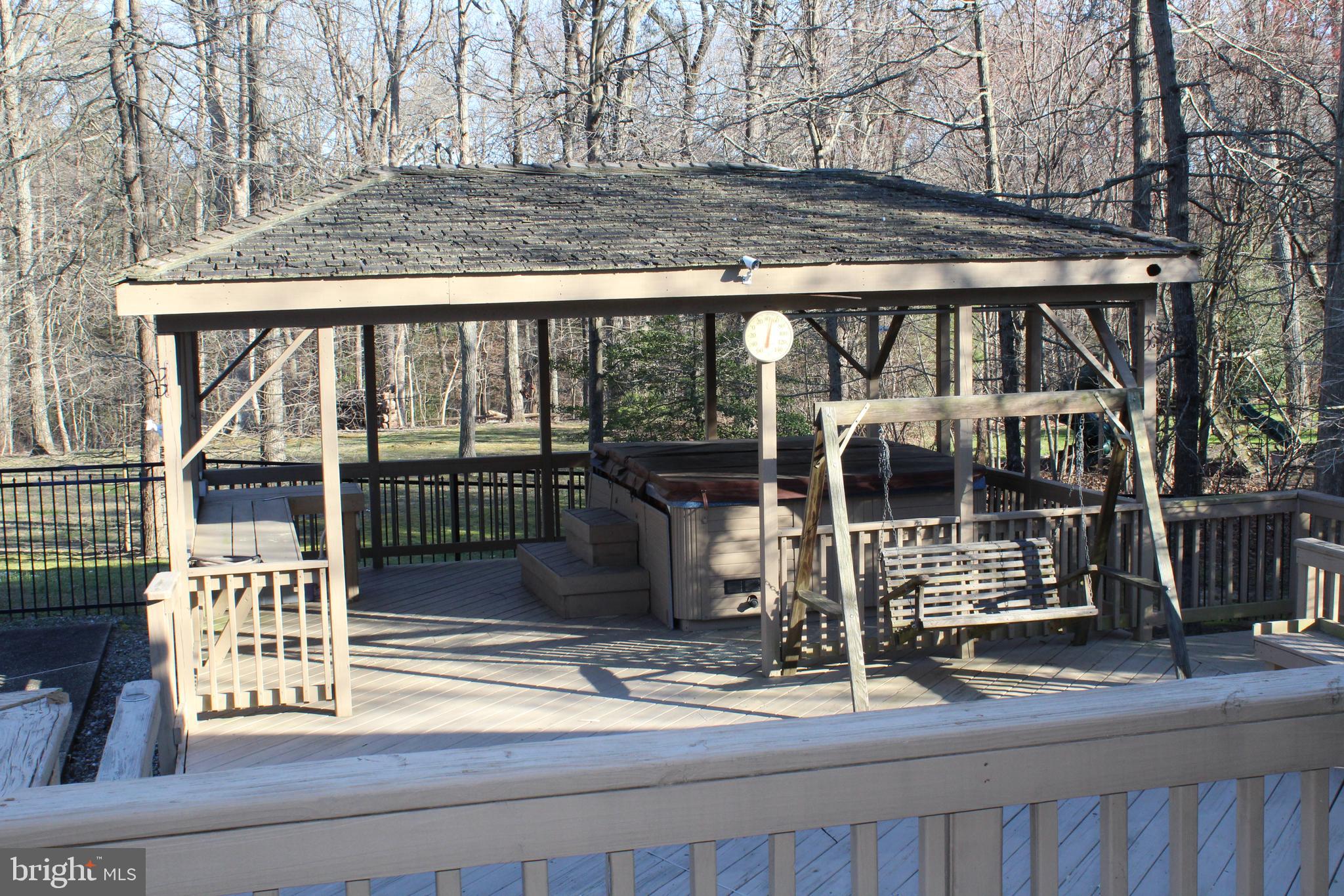 8385 Maryland Road Pasadena, MD 21122 - Photo 19 of 21 Gazebo w/crab bar, Hot tub area and swing