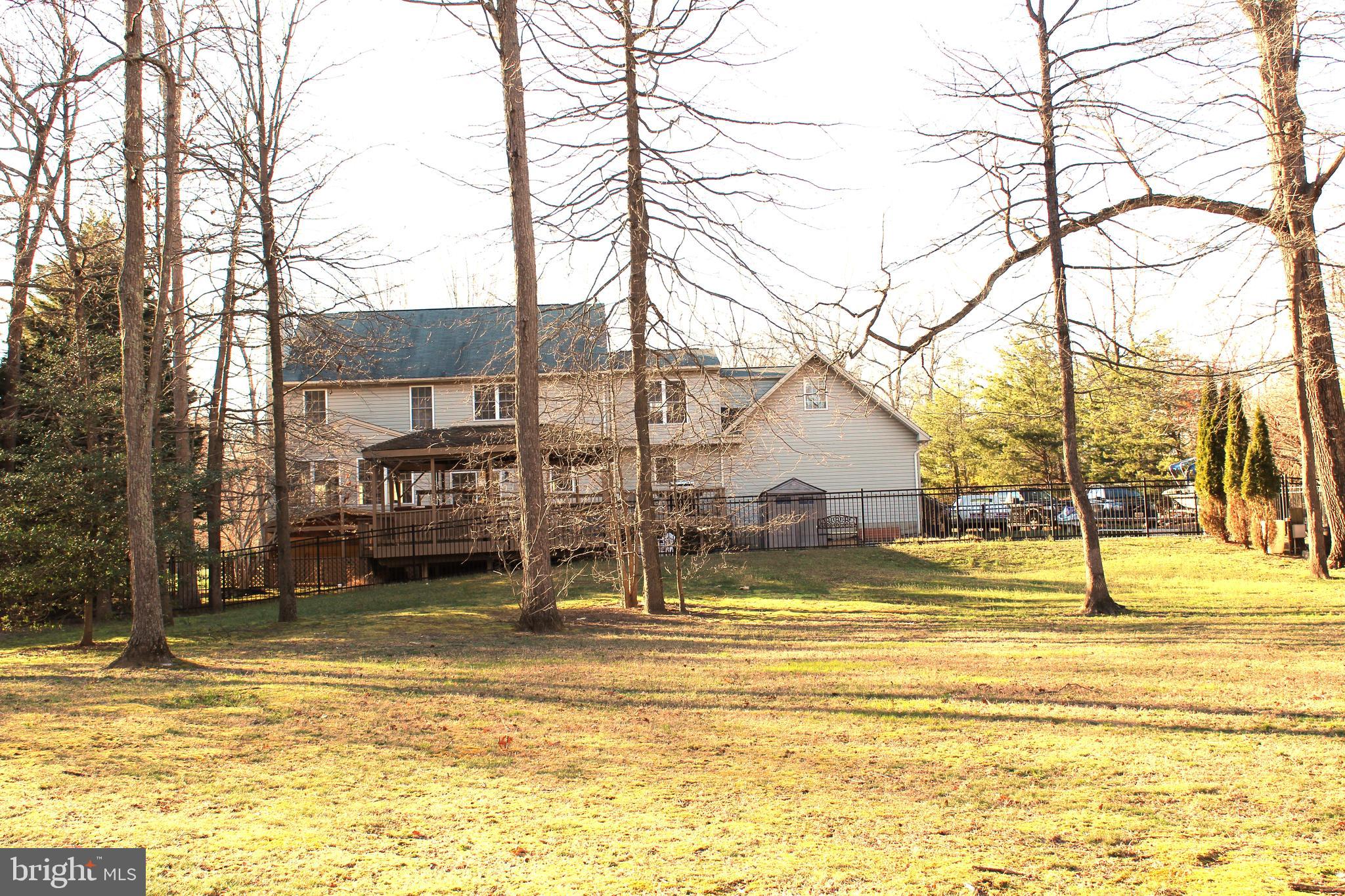 8385 Maryland Road Pasadena, MD 21122 - Photo 20 of 21 View from the back of the yard toward the home.