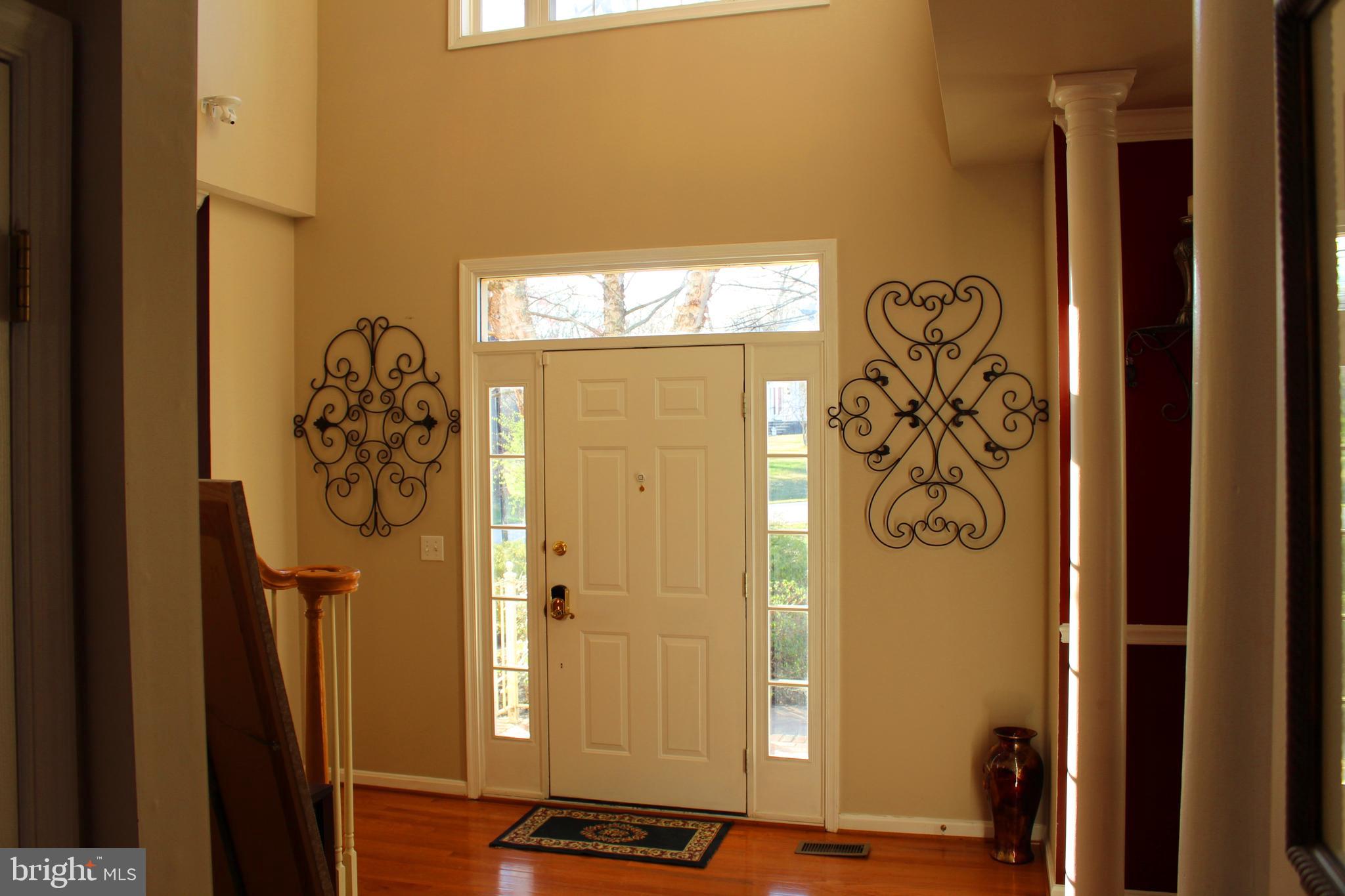 8385 Maryland Road Pasadena, MD 21122 - Photo 3 of 21 Front door entrance foyer area viewed from Kitchen