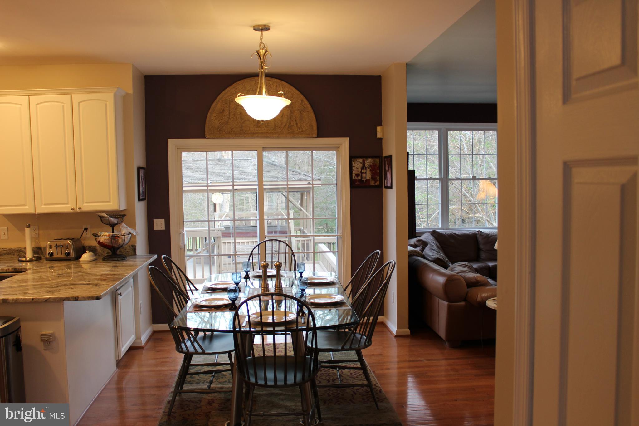 8385 Maryland Road Pasadena, MD 21122 - Photo 6 of 21 Hallway to Kitchen, eat-in and family rooms