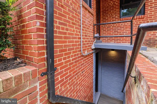 a view of a brick building from the balcony