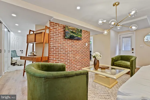 a work room with furniture and a chandelier