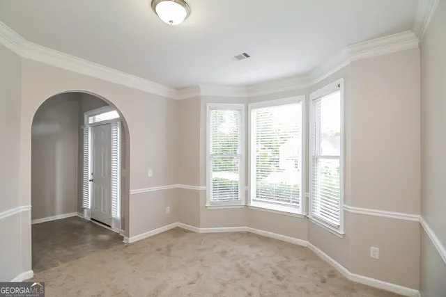 an empty room with windows