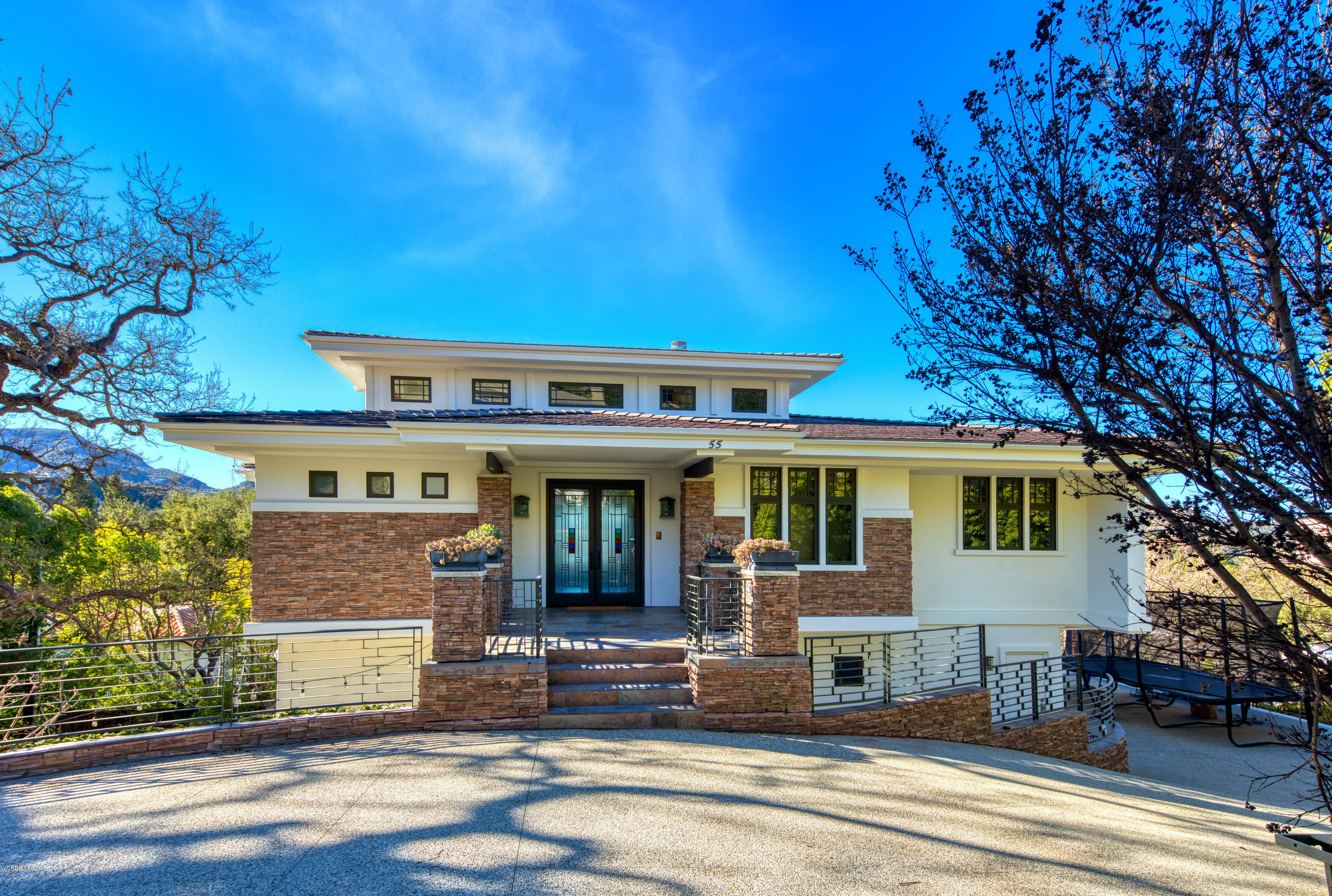 55 Upper Lake Road Westlake Village, CA 91361 - Photo 2 of 40 a front view of a house with a tree