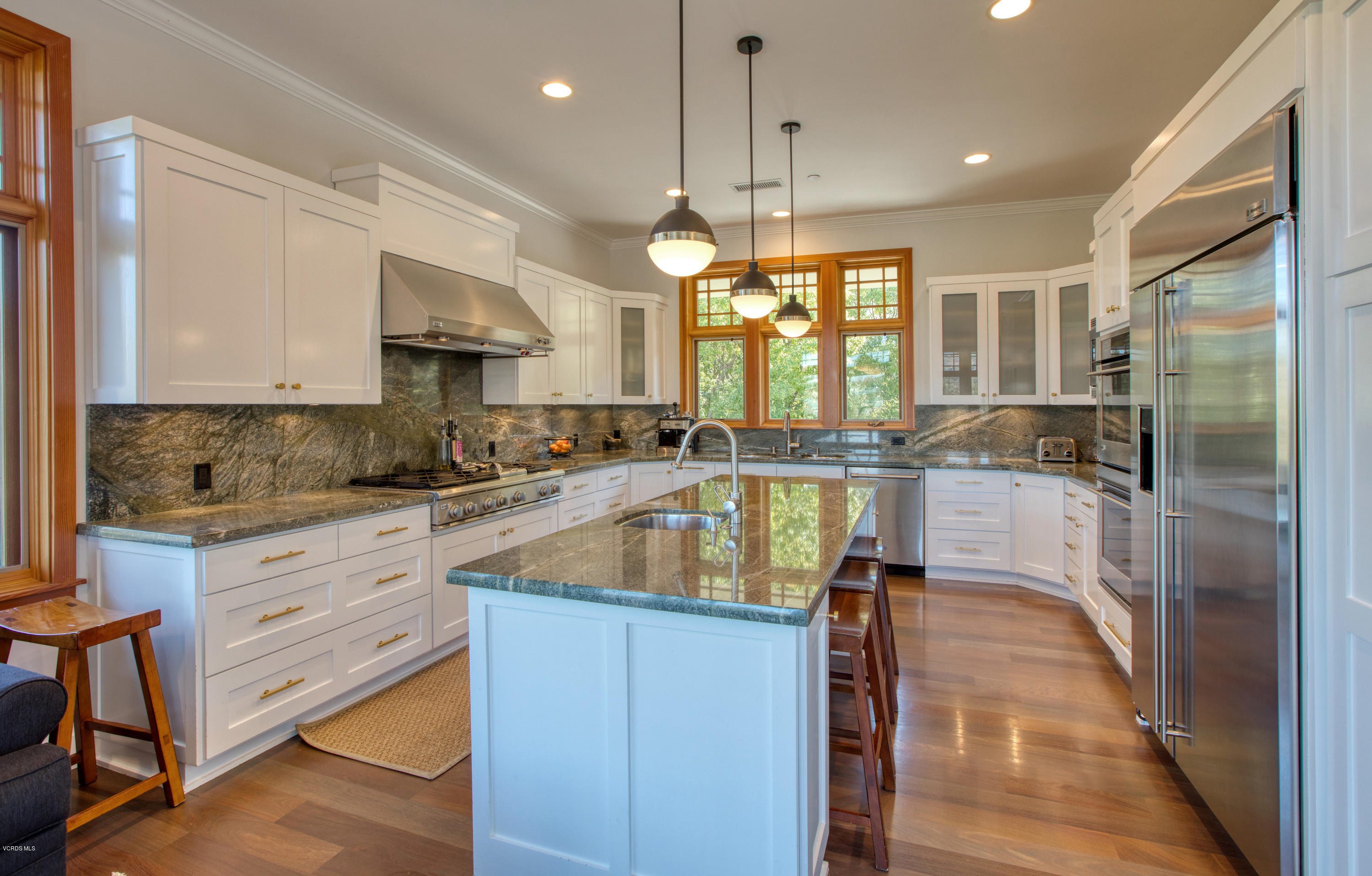 55 Upper Lake Road Westlake Village, CA 91361 - Photo 12 of 40 a kitchen with stainless steel appliances granite countertop a stove a sink and a refrigerator