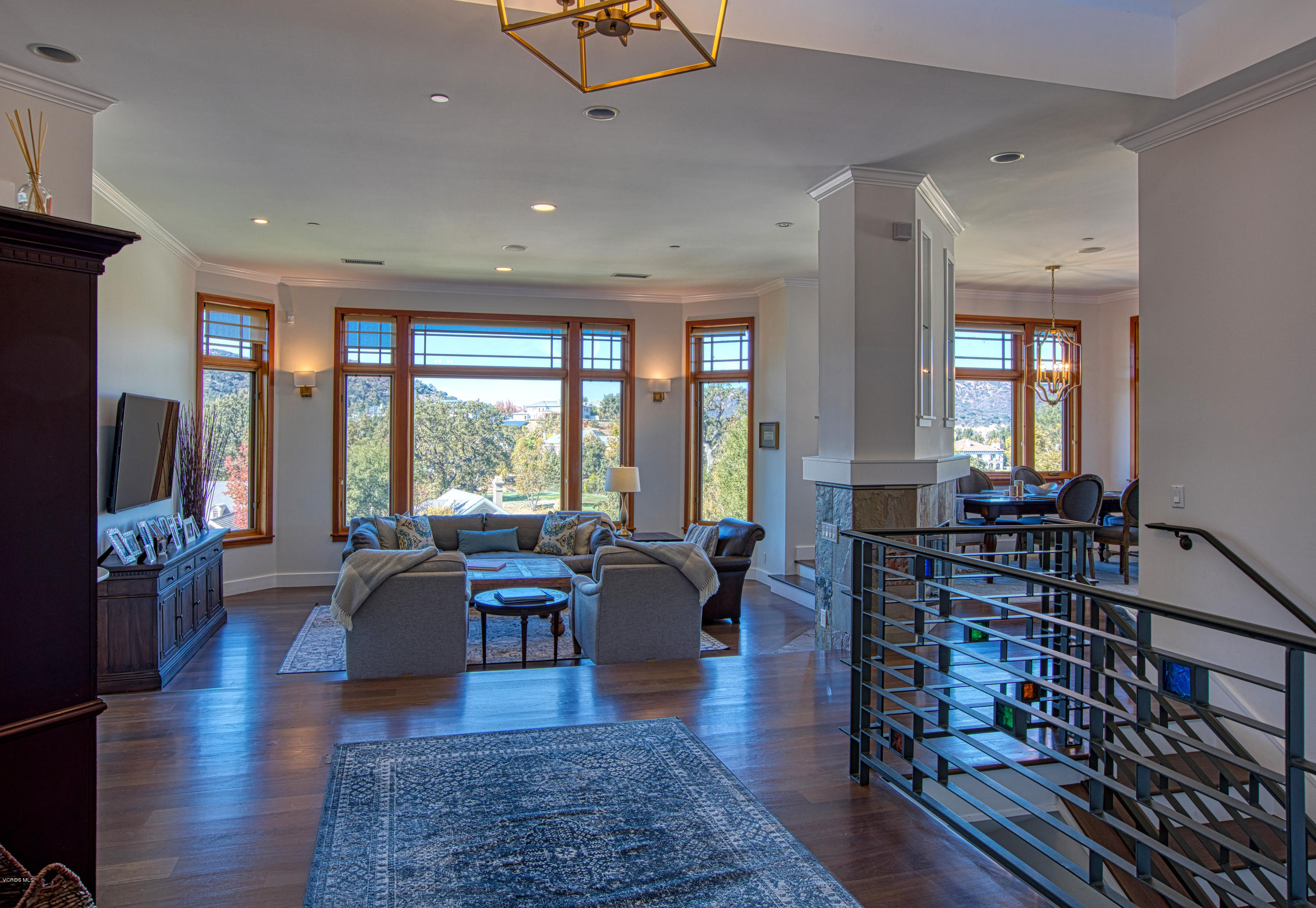 55 Upper Lake Road Westlake Village, CA 91361 - Photo 16 of 40 a living room with furniture a large window and wooden floor