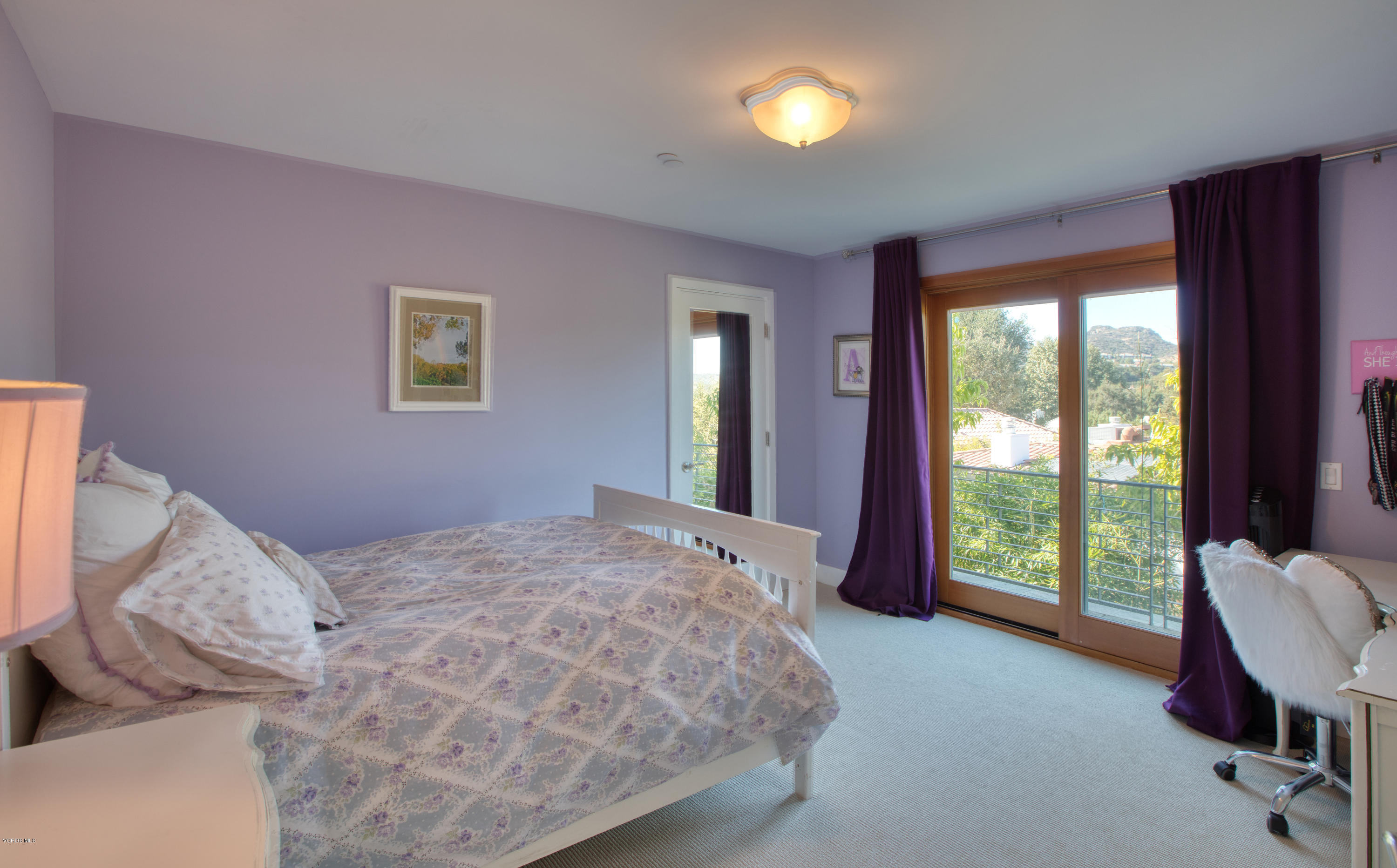 55 Upper Lake Road Westlake Village, CA 91361 - Photo 19 of 40 a bedroom with a bed and large windows