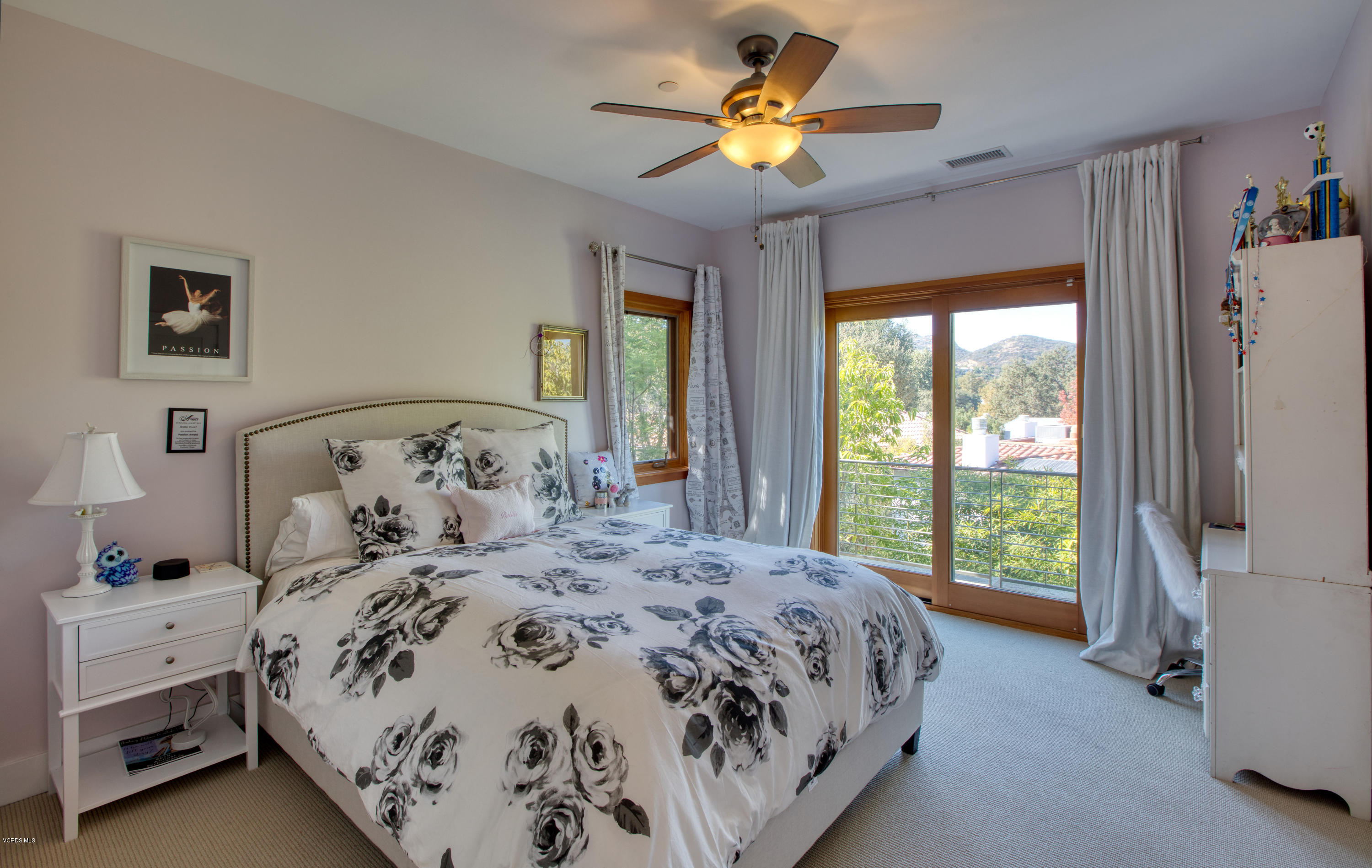 55 Upper Lake Road Westlake Village, CA 91361 - Photo 20 of 40 a bedroom with a large bed and a chandelier