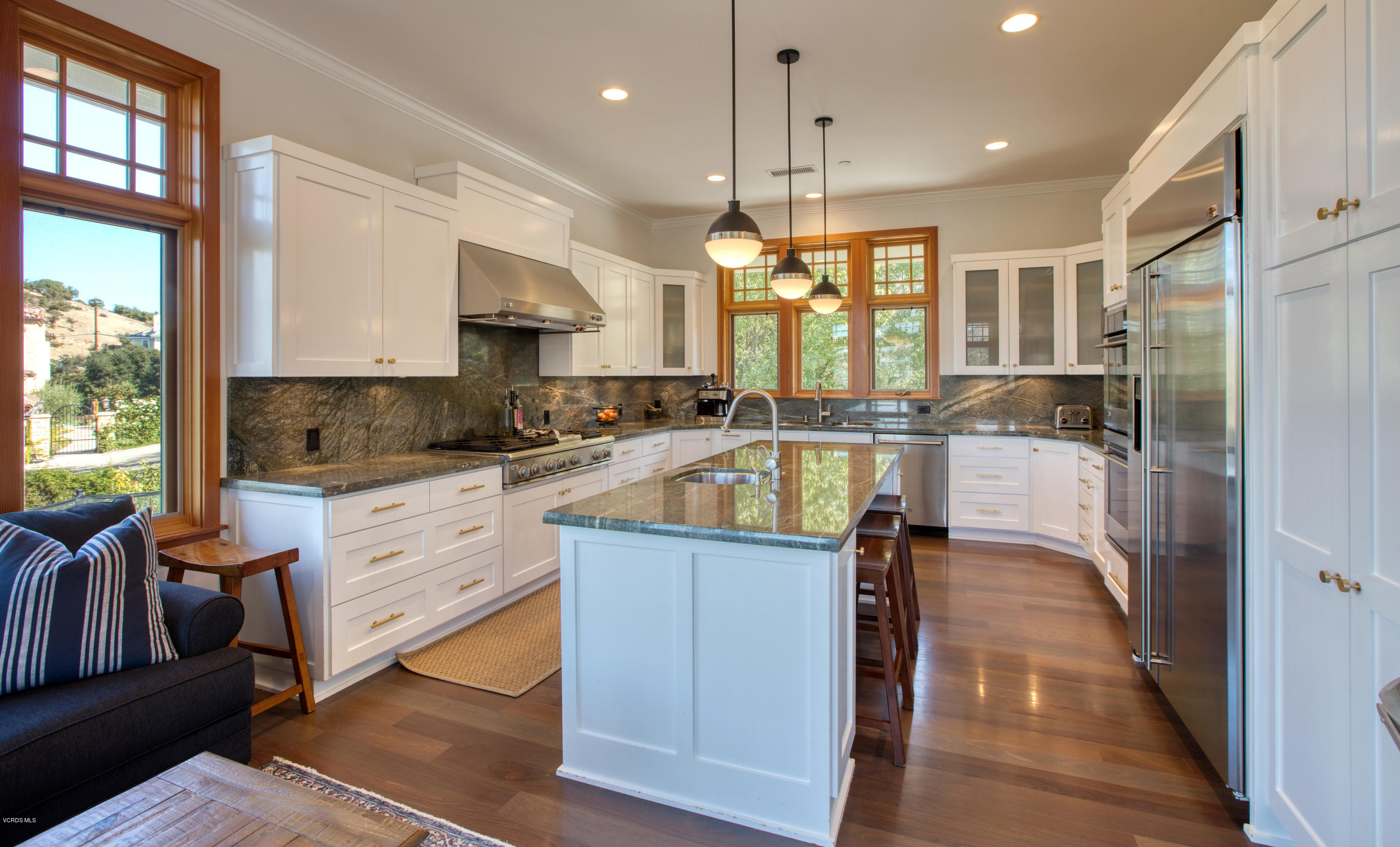 55 Upper Lake Road Westlake Village, CA 91361 - Photo 3 of 40 a kitchen with kitchen island granite countertop a stove a sink and a refrigerator