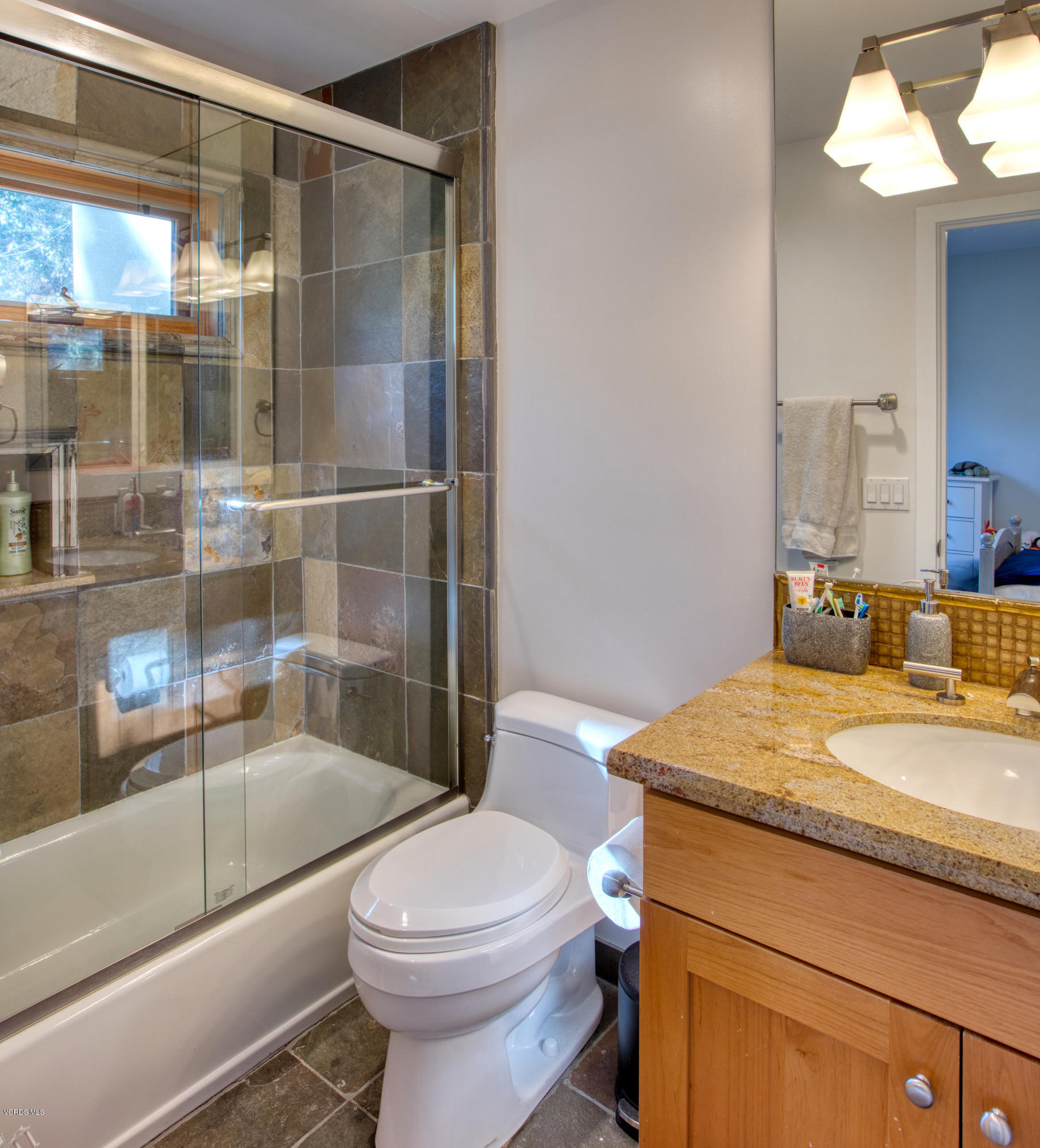 55 Upper Lake Road Westlake Village, CA 91361 - Photo 23 of 40 a bathroom with a granite countertop sink toilet and shower