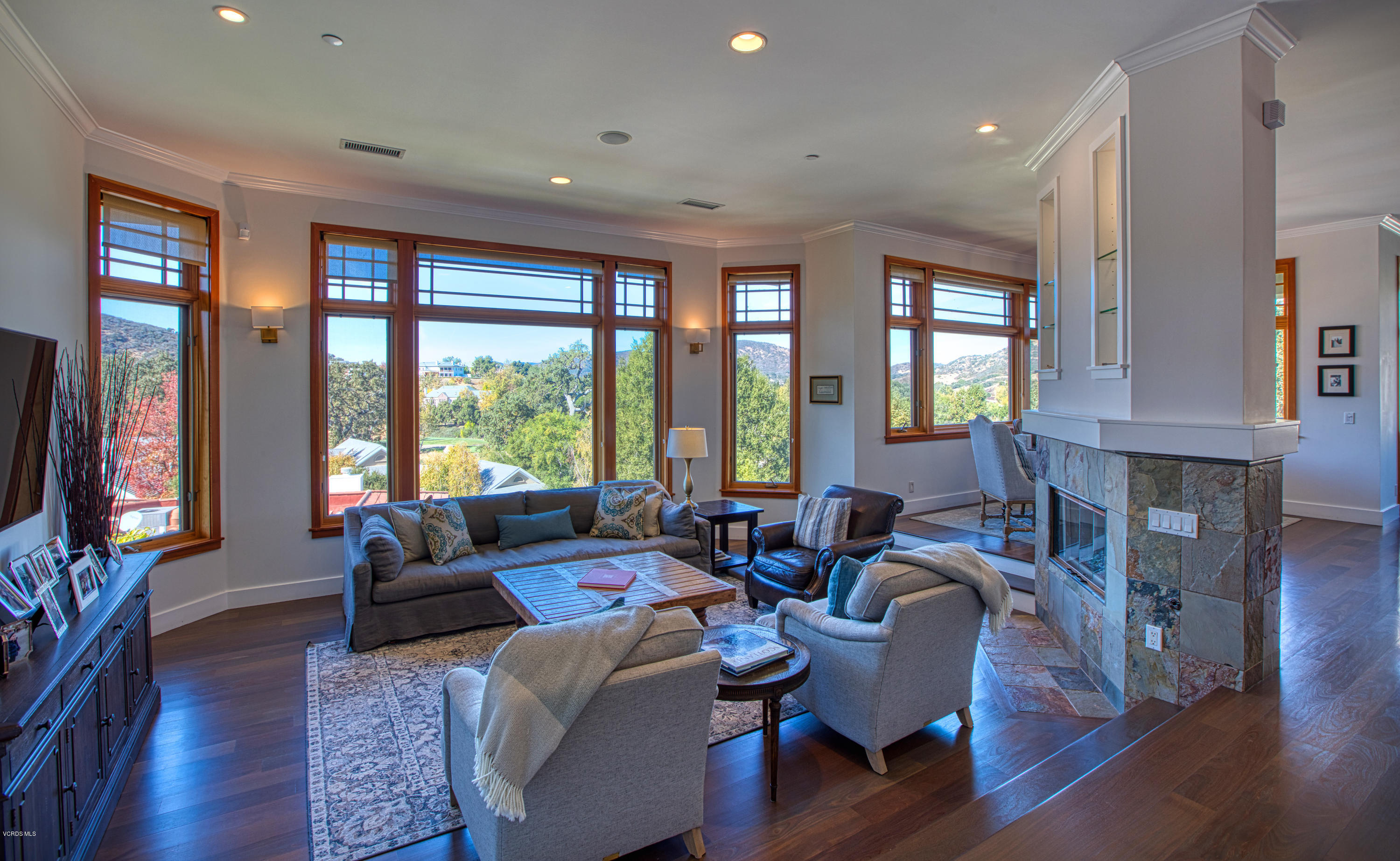 55 Upper Lake Road Westlake Village, CA 91361 - Photo 4 of 40 a living room with fireplace furniture and a large window
