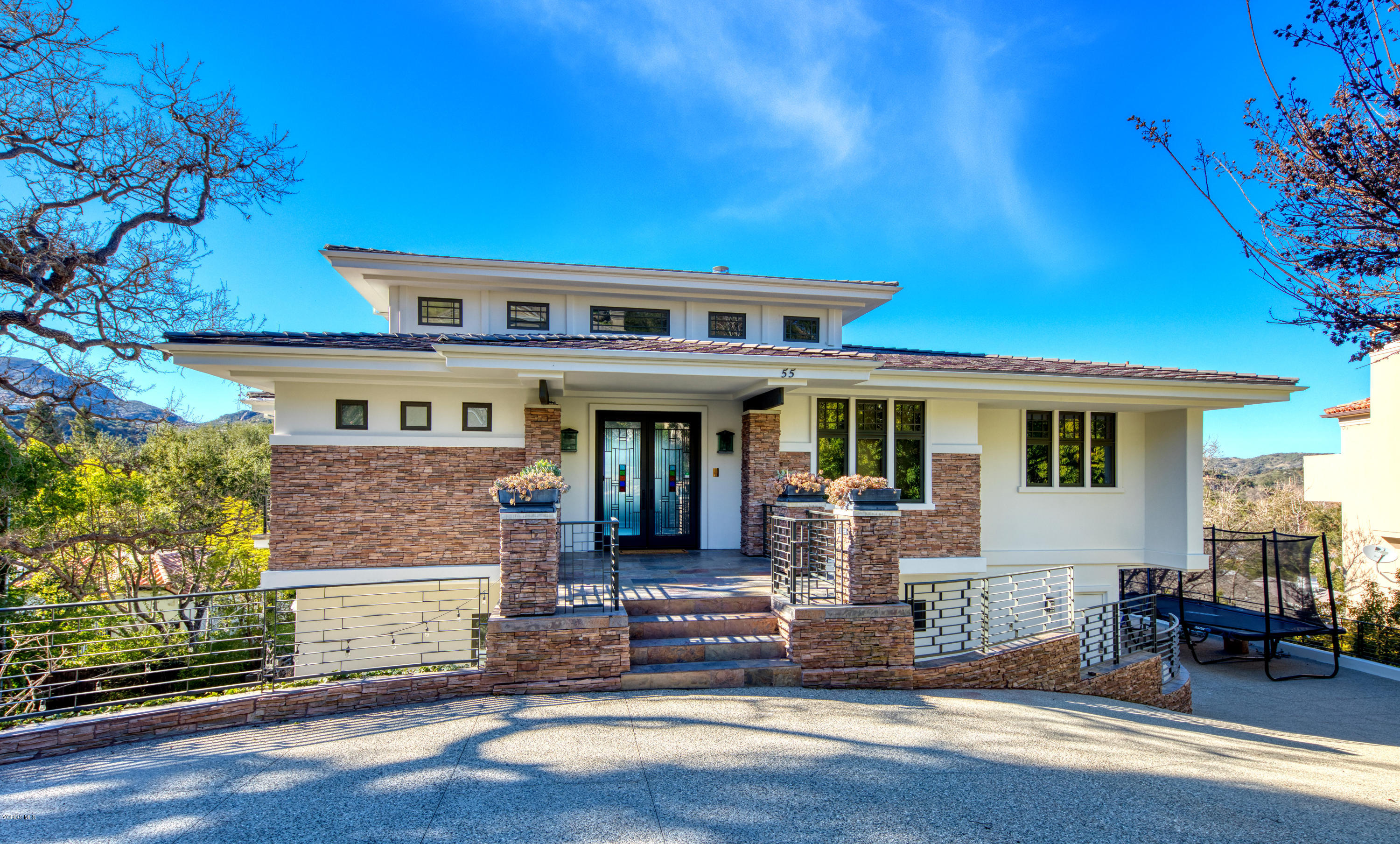 55 Upper Lake Road Westlake Village, CA 91361 - Photo 7 of 40 a front view of a house with a yard