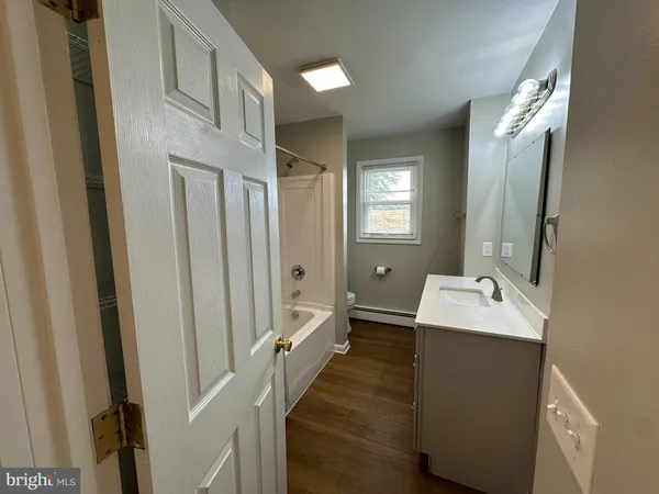 a bathroom with a sink a mirror and a toilet