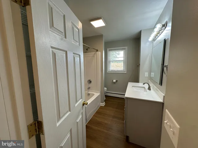 a bathroom with a sink a mirror and a toilet