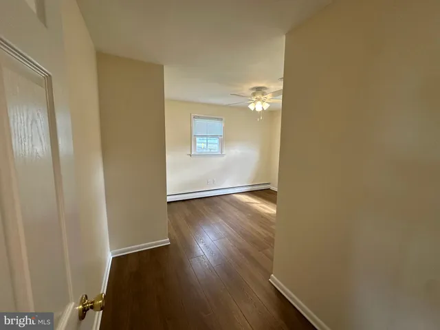 an empty room with wooden floor