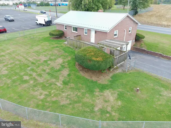 an aerial view of a house with swimming pool garden and patio