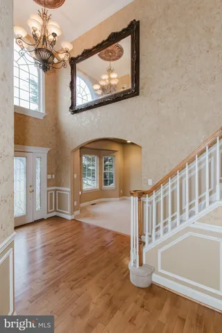 an empty room with wooden floor