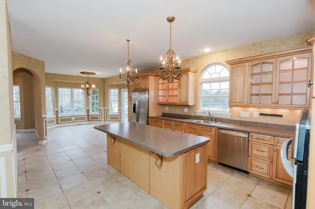 an empty room with wooden floor and fireplace