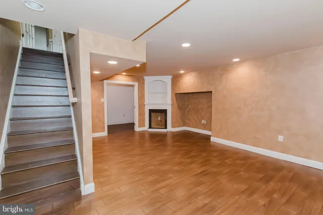 a spacious bathroom with a bathtub sink and mirror