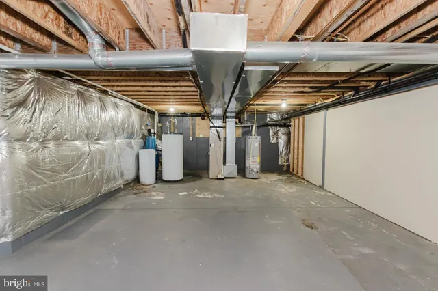 a bathroom with a tub a window and a shower