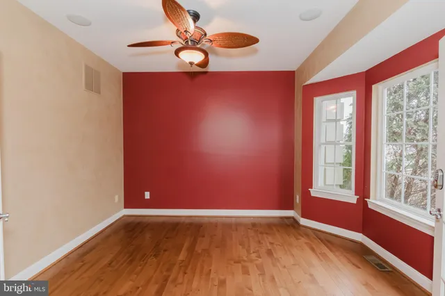 a view of staircase with wooden floor and a window