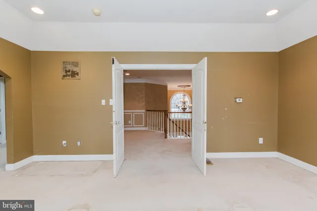 a view of an entryway with wooden floor and windows