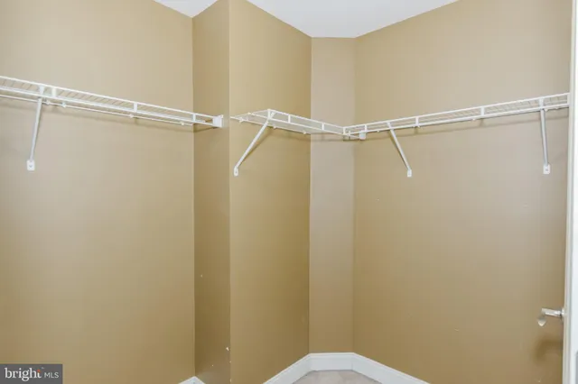 a view of a livingroom with furniture wooden floor and chandelier