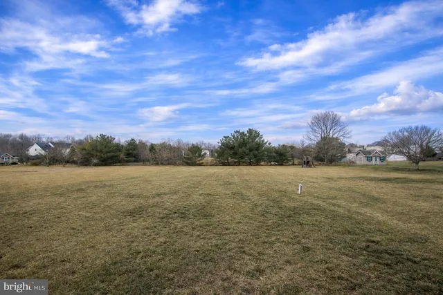 a kitchen with kitchen island granite countertop a stove and a sink