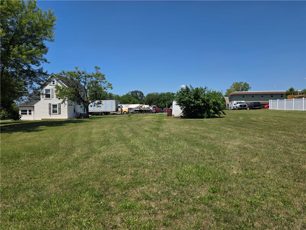 5166 Springmill Road Whitehall, PA 18052 - Photo 4 of 29 A classic two-story residence with white siding and black shutters stands proudly on an expansive grassy plot.