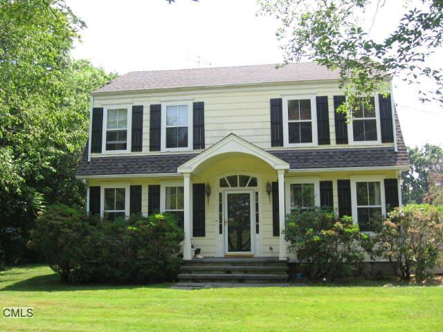 307 High Ridge Road Stamford, CT 06905 - Photo 1 of 1 a front view of a house with a yard