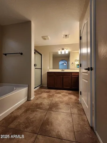 a bathroom with a sink a mirror and a bathtub