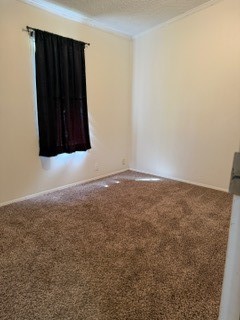 215 Parrish Street New Waverly, TX 77358 - Photo 6 of 12 an empty room with a window