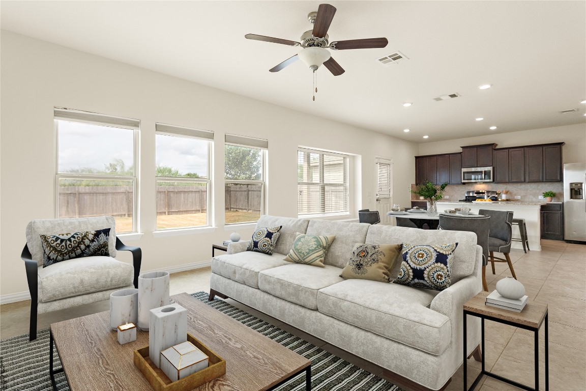 a living room with furniture and a large window