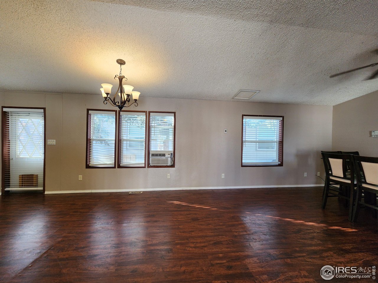 5000 Butte Street, Unit 208 Boulder, CO 80301 - Photo 12 of 37 a view of a livingroom with furniture wooden floor fireplace and windows