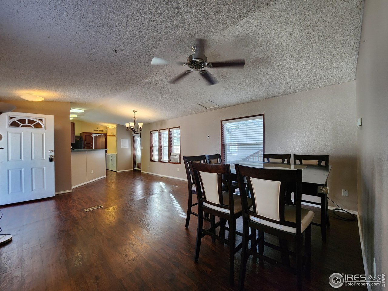 5000 Butte Street, Unit 208 Boulder, CO 80301 - Photo 14 of 37 a view of a dining room with furniture and wooden floor