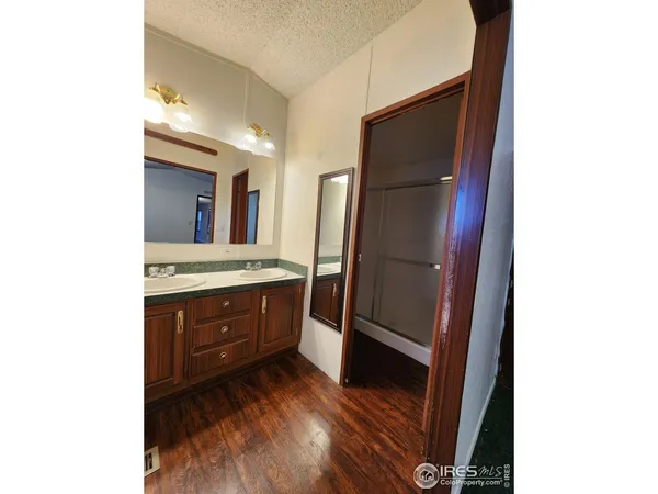 a bathroom with a glass shower door