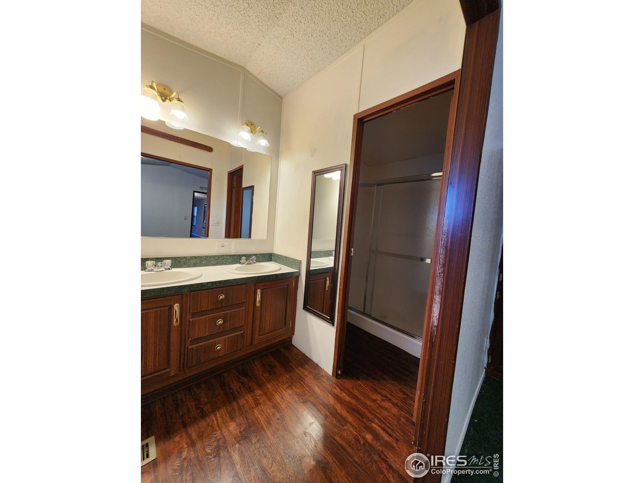 5000 Butte Street, Unit 208 Boulder, CO 80301 - Photo 20 of 37 a bathroom with a sink a mirror and a shower