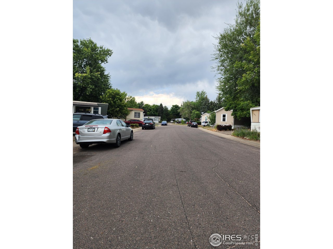 5000 Butte Street, Unit 208 Boulder, CO 80301 - Photo 36 of 37 a view of a city street with parked cars