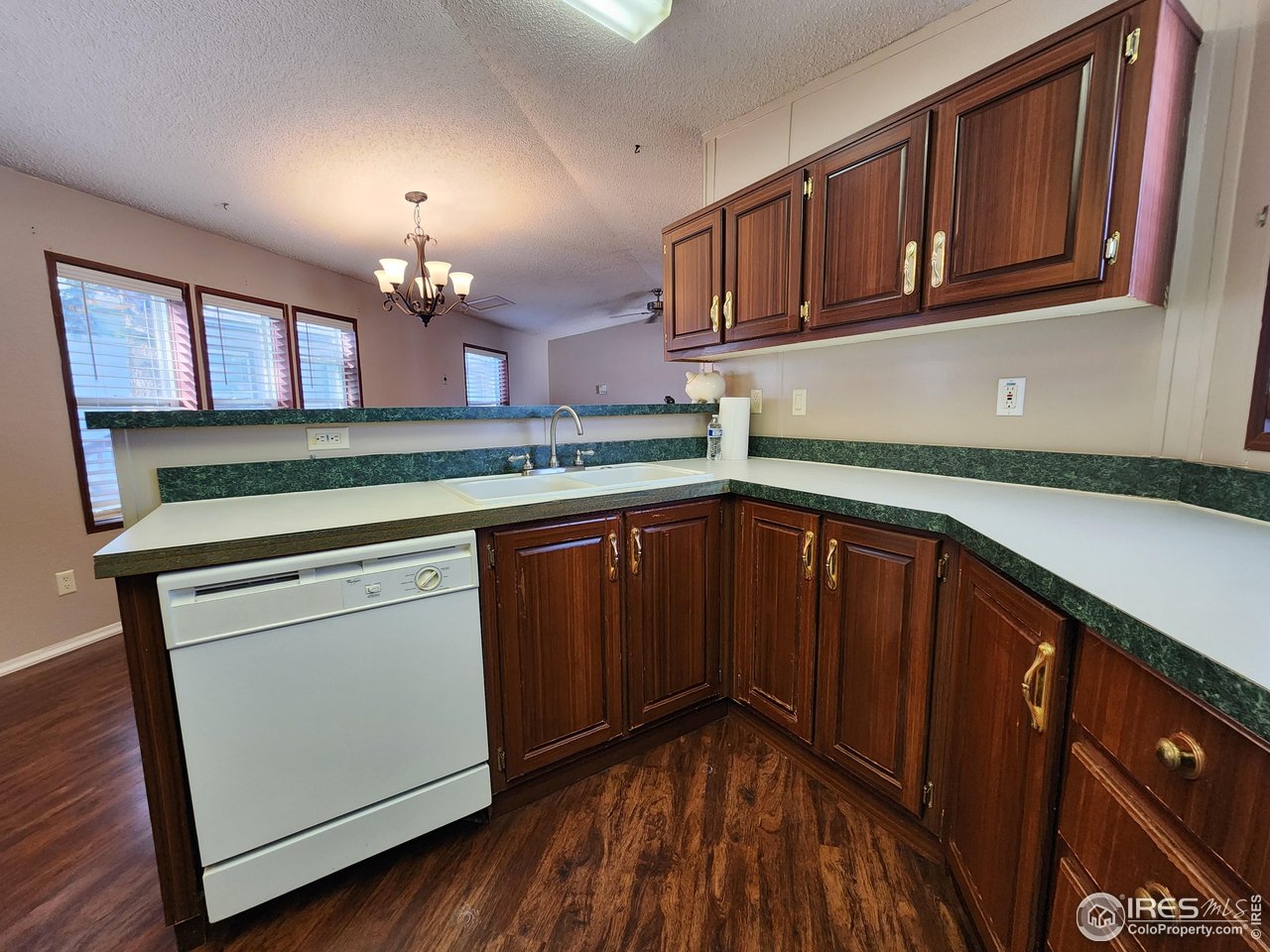 5000 Butte Street, Unit 208 Boulder, CO 80301 - Photo 8 of 37 a kitchen with a sink cabinets and wooden floor