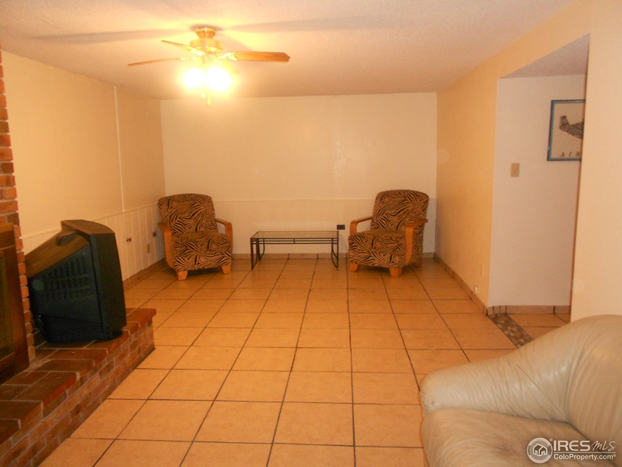 2428 West 24th Street Road Greeley, CO 80634 - Photo 19 of 25 Large family room with tile floor