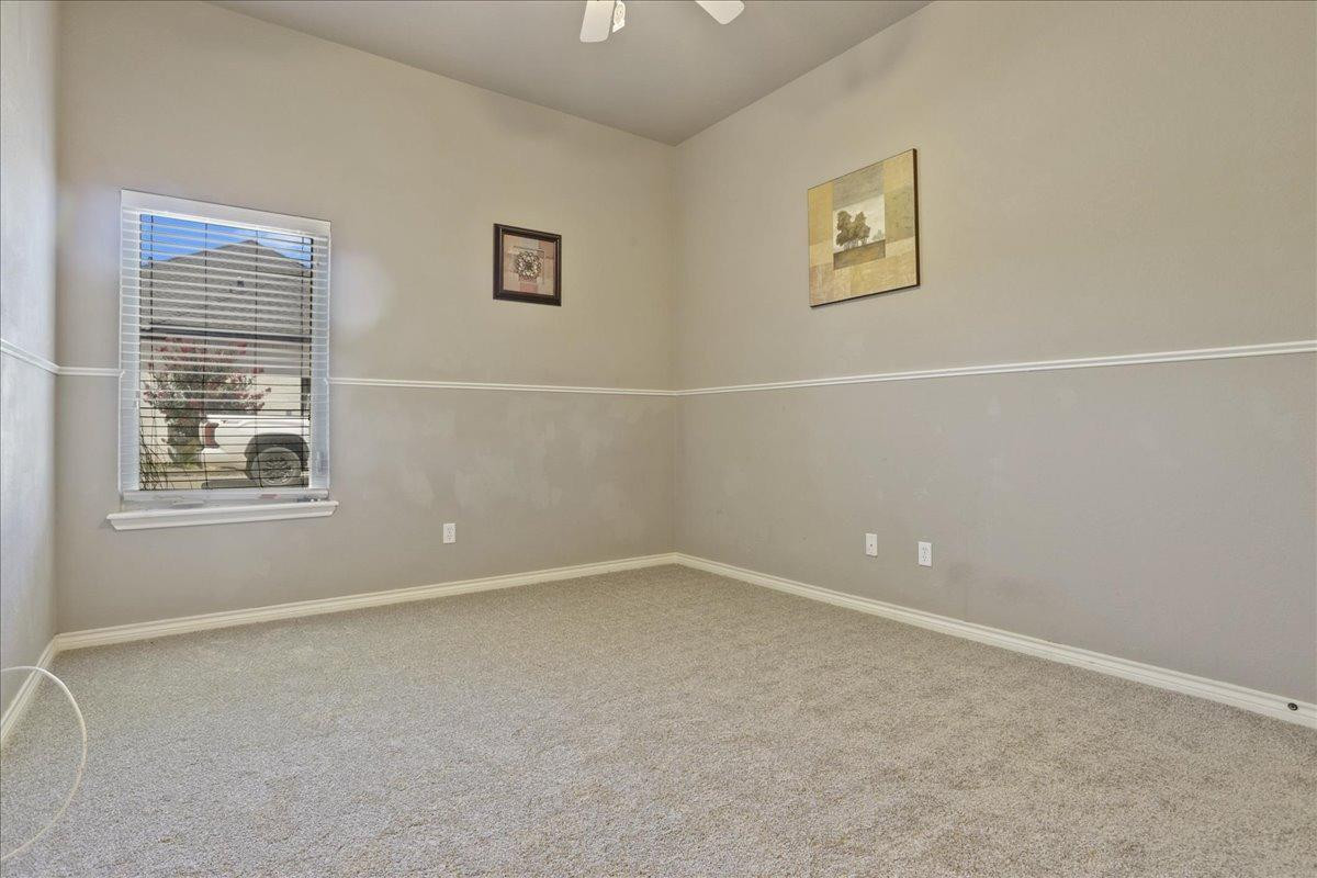 6304 County Road 7475 Lubbock, TX 79424 - Photo 20 of 28 an empty room with windows