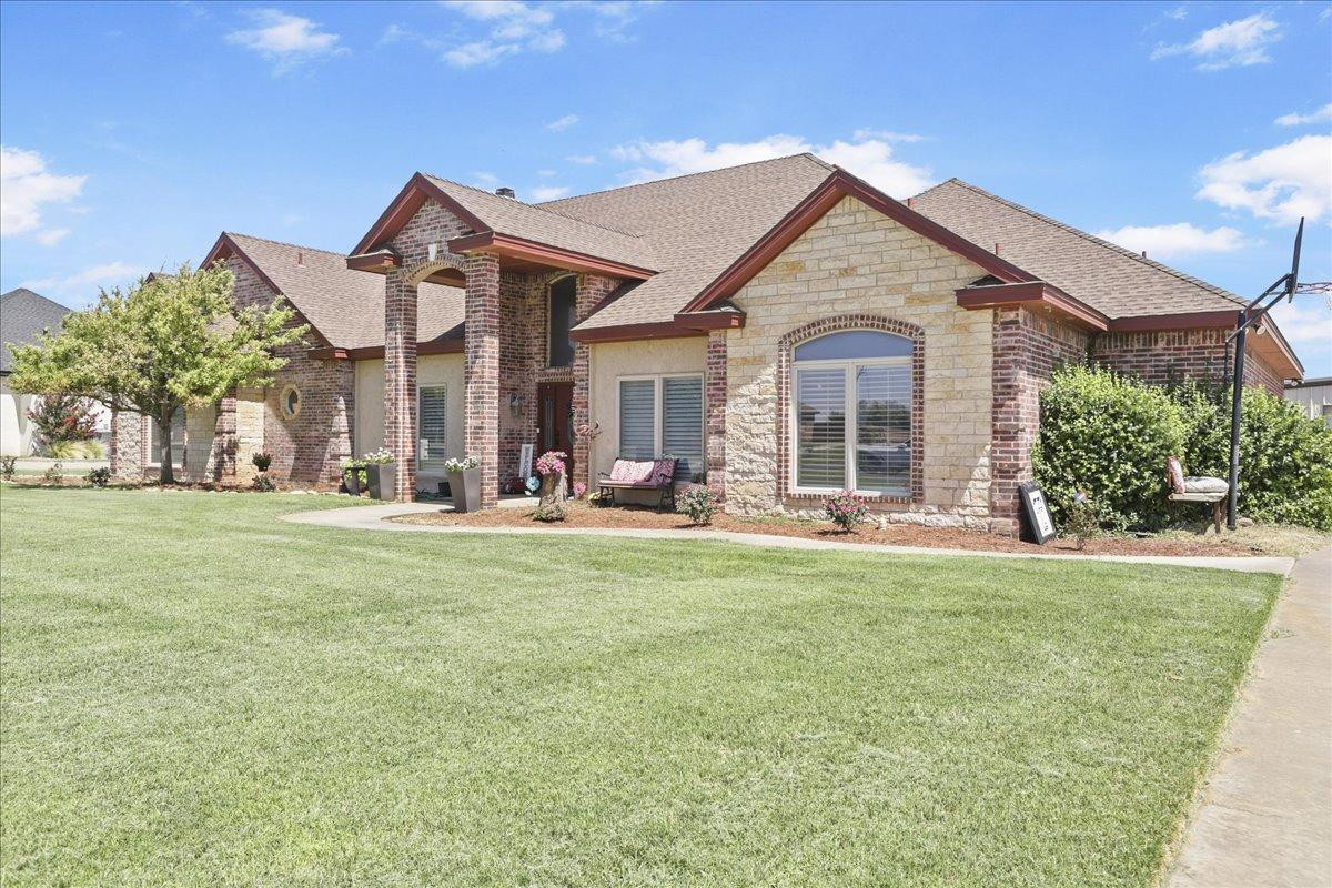 6304 County Road 7475 Lubbock, TX 79424 - Photo 3 of 28 a front view of a house with a yard