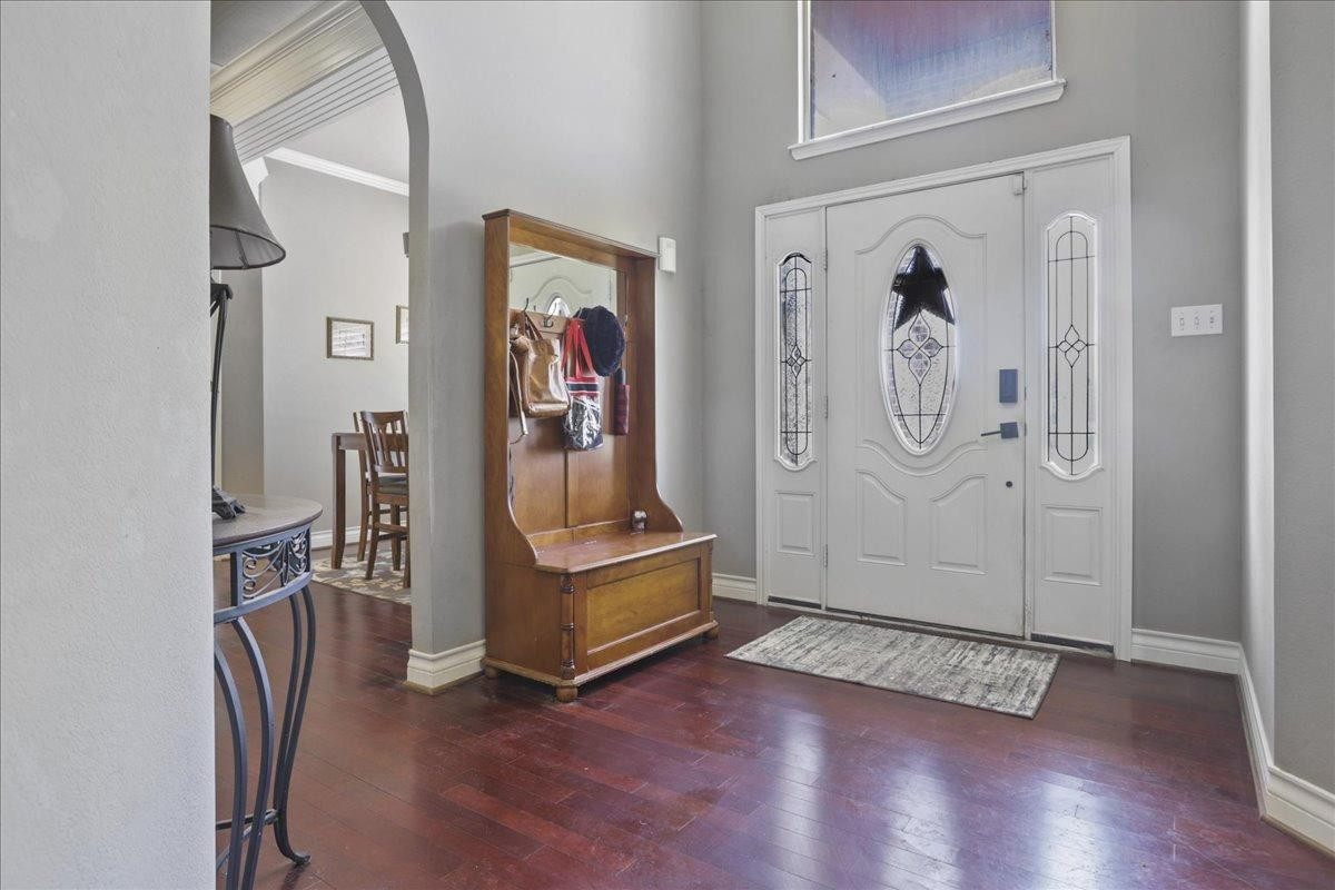 6304 County Road 7475 Lubbock, TX 79424 - Photo 4 of 28 a view of a hallway with wooden floor and closet