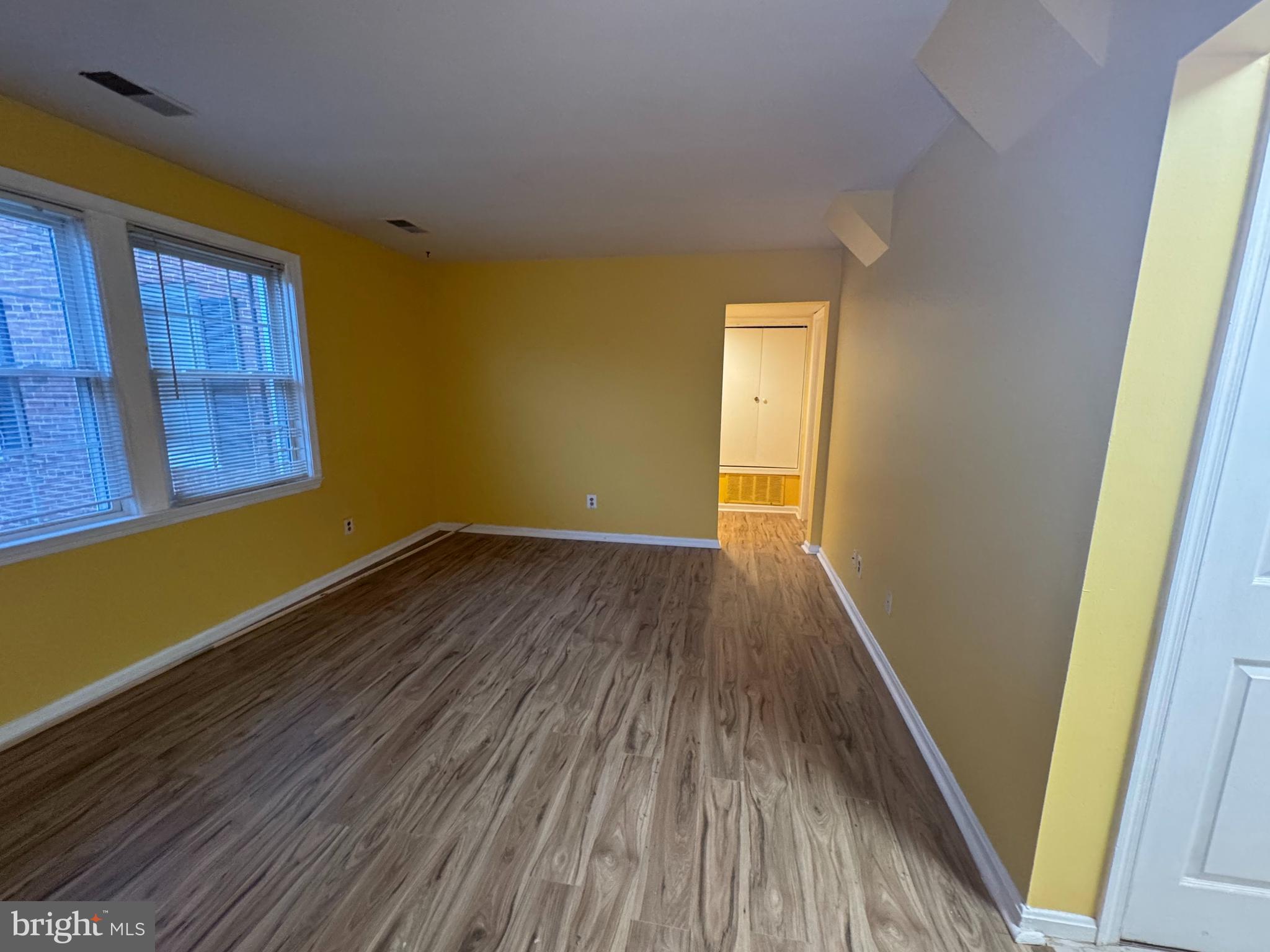 3812 W Street Southeast, Unit 101 Washington, DC 20020 - Photo 9 of 17 Living room leading to primary bedroom