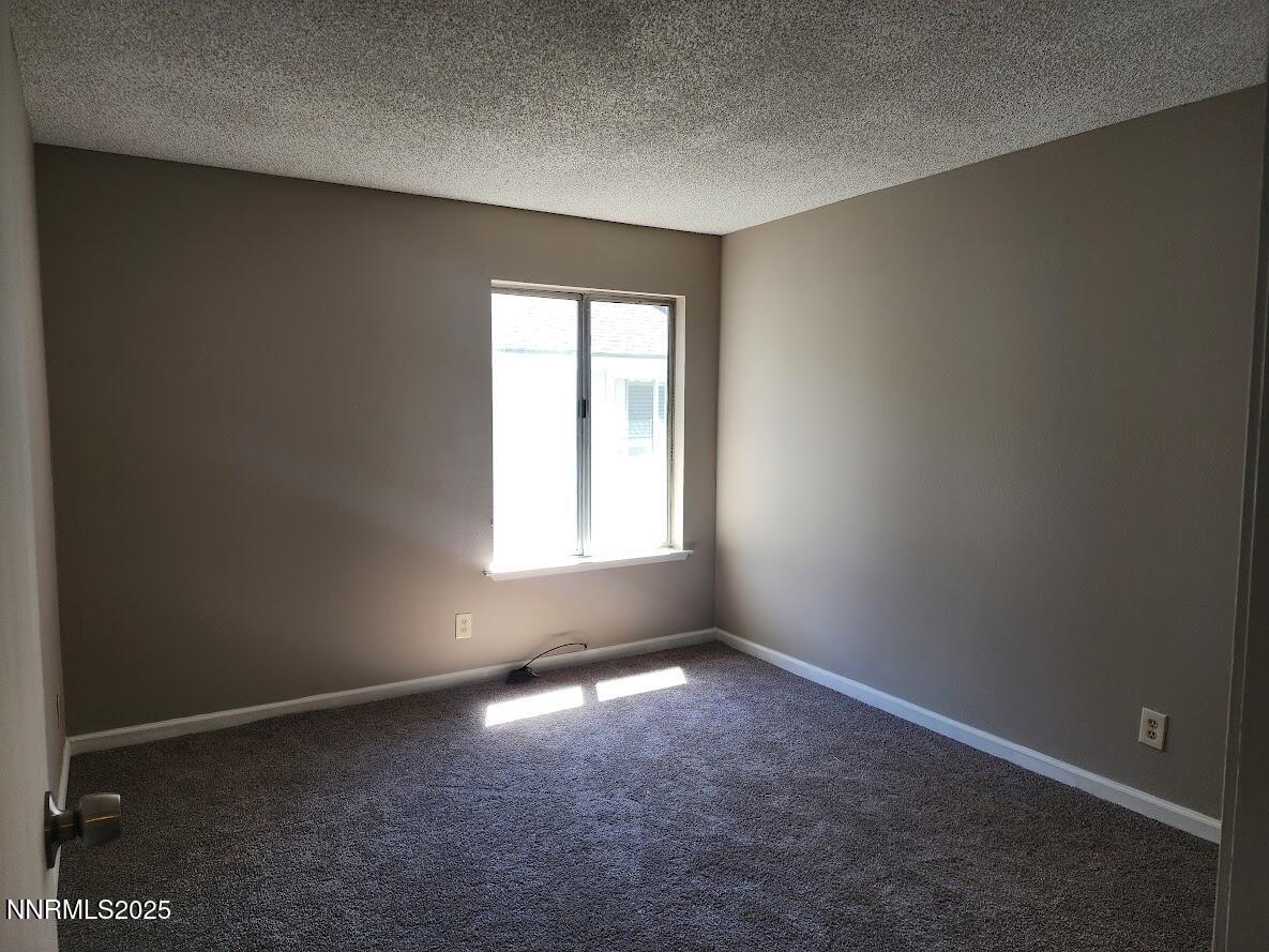 4604 Neil Road, Unit 142 Reno, NV 89502 - Photo 13 of 23 an empty room with windows